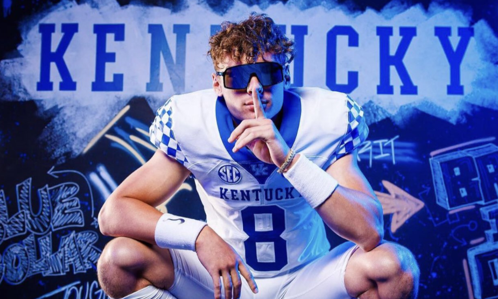Top 25 quarterback prospect Stone Saunders posing in a Kentucky Football uniform during a recruiting visit.