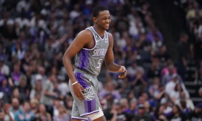Sacramento Kings guard De'Aaron Fox (5) smiles during a break in the action against the Golden State Warriors