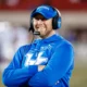 Kentucky Wildcats offensive coordinator on the sidelines at Kroger Field.