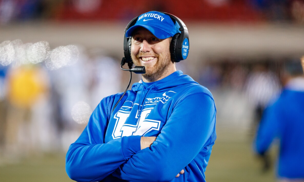Kentucky Wildcats offensive coordinator on the sidelines at Kroger Field.