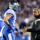 Kentucky football coach Vince Marrow greeting player back to the sideline against South Carolina
