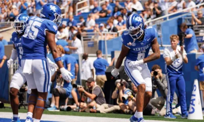 Kentucky Wildcats wide receiver Dane Key (6) and tight end Jordan Dingle (85) celebrate after Key scores a touchdown during the third quarter at Kroger Field.