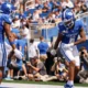 Kentucky Wildcats wide receiver Dane Key (6) and tight end Jordan Dingle (85) celebrate after Key scores a touchdown during the third quarter at Kroger Field.