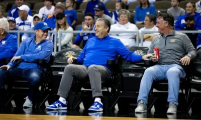 Kentucky basketball head coach John Calipari laughing with fans during Kentucky's annual Blue-White game.