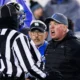Kentucky Wildcats head coach Mark Stoops argues with a referee during the game against the Georgia Bulldogs at Kroger Field.
