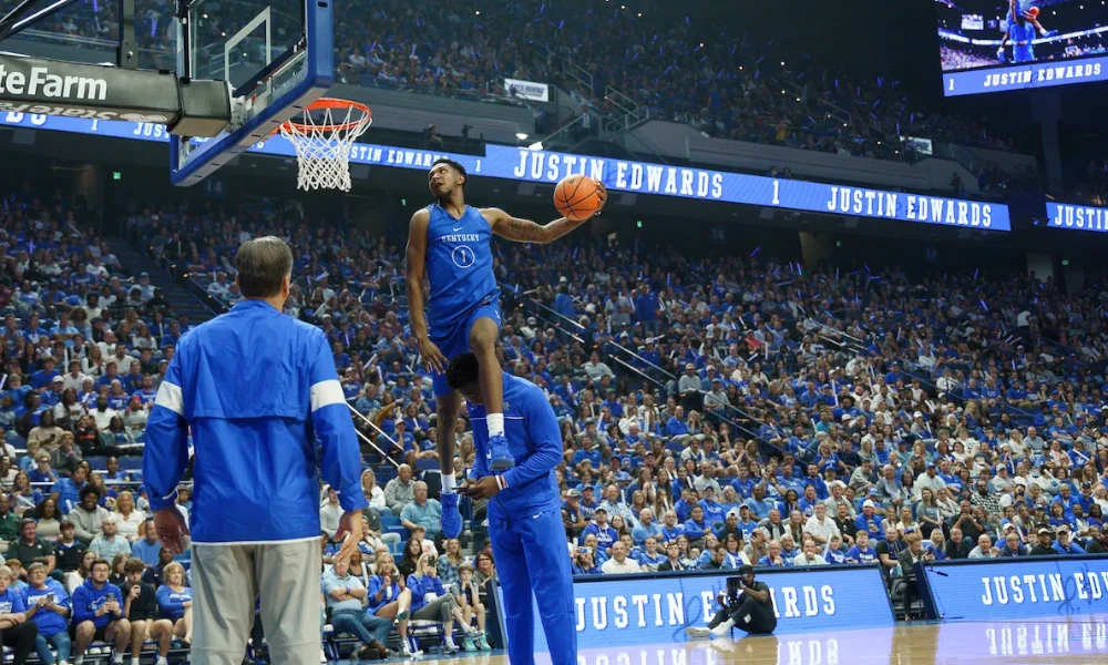 Justin Edwards dunking over teammate Adou Thiero at Kentucky Basketball's Big Blue Madness.