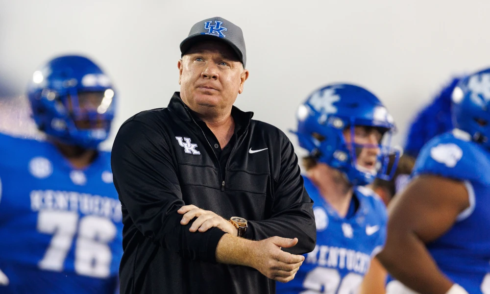 Kentucky Wildcats head coach Mark Stoops runs onto the field before the game against the Akron Zips at Kroger Field.