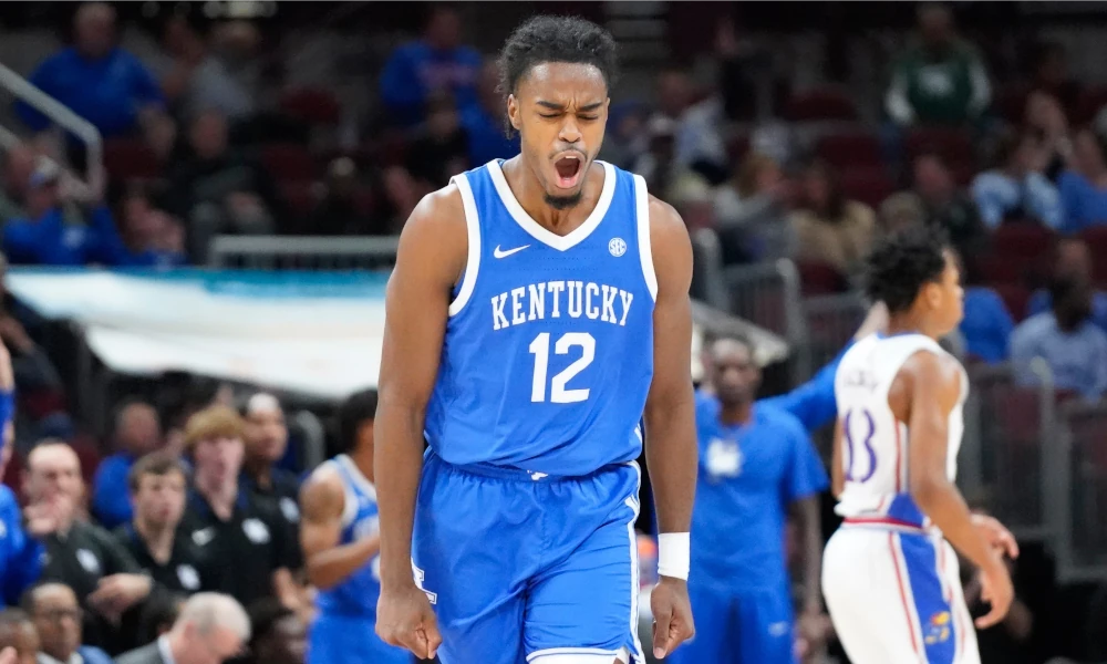 Kentucky Wildcats guard Antonio Reeves (12) reacts after scoring against the Kansas Jayhawks.