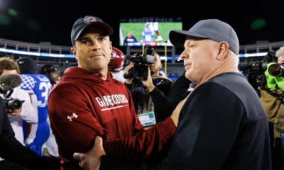 South Carolina Gamecocks head coach Shane Beamer and Kentucky Wildcats head coach Mark Stoops shake hands after a game at Kroger Field.
