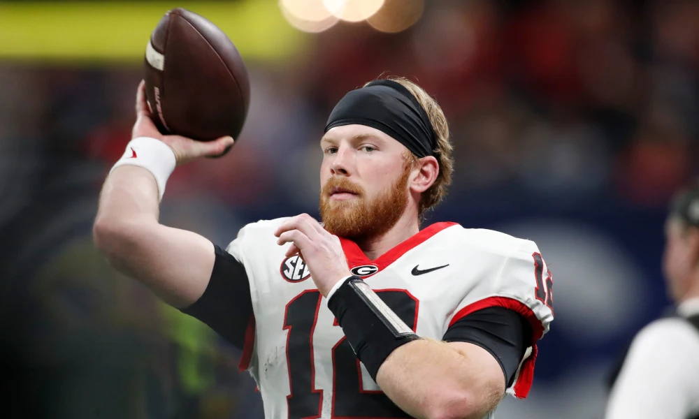 warms up before the start of the SEC Championship game against Alabama at Mercedes-Benz Stadium.