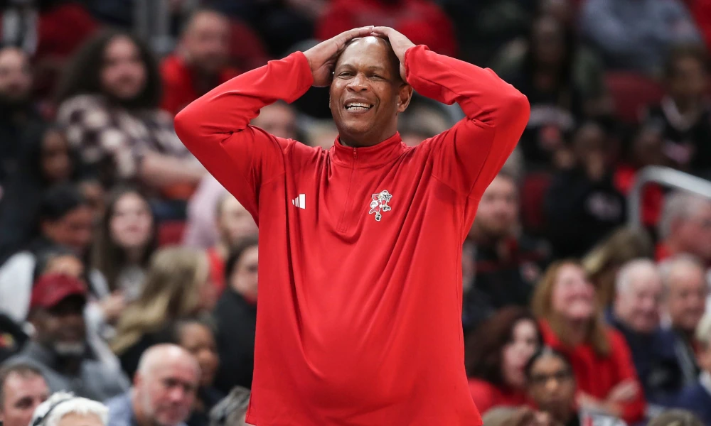 Louisville head coach Kenny Payne reacting negatively from the sidelines.