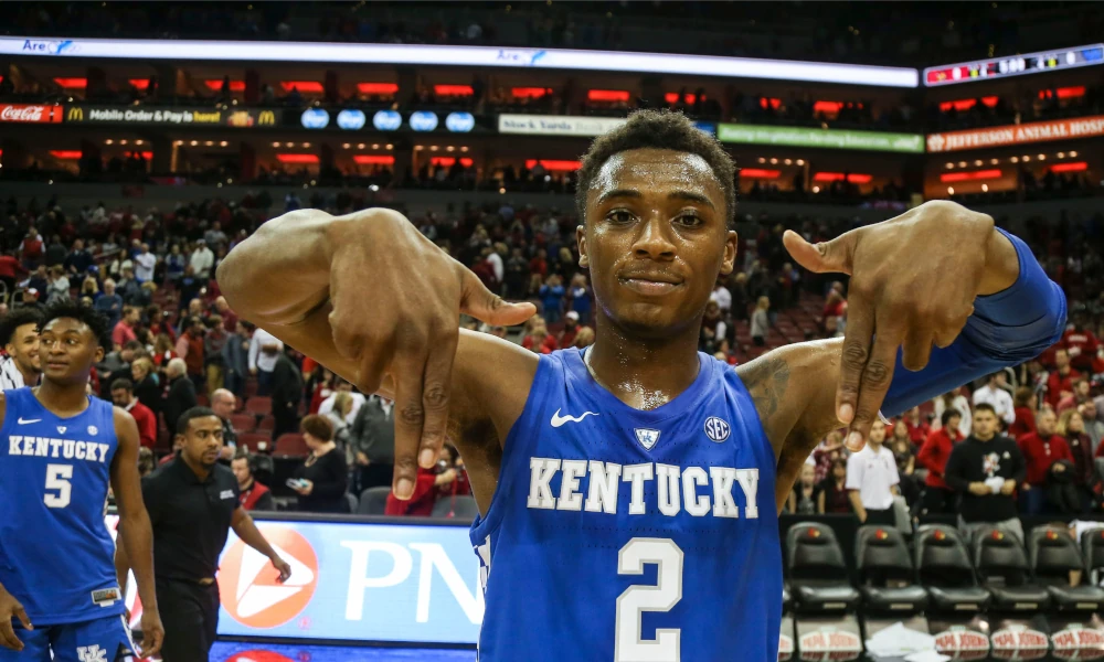Kentucky Wildcats guard Ashton Hagans throws up L's down after beating the Louisville Cardinals at the KFC Yum Center.