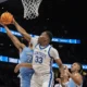 Kentucky Wildcats center Ugonna Onyenso blocks a North Carolina player.