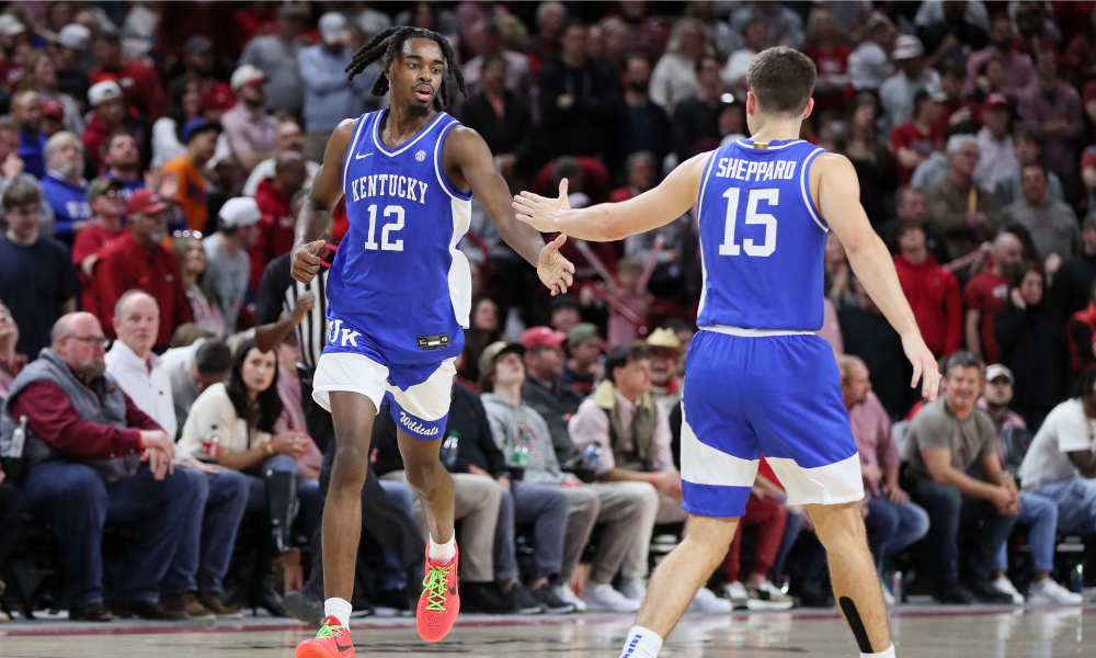 Kentucky Wildcats guard Antonio Reeves (12) celebrates with guard Reed Sheppard (15) after making a three point shot against Arkansas.