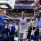 Kentucky Wildcats center Zvonimir Ivisic celebrates with Kentucky fans at Rupp Arena after his impressive debut.