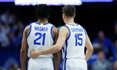 Kentucky Wildcats guard Reed Sheppard and DJ Wagner supporting each other during the game.
