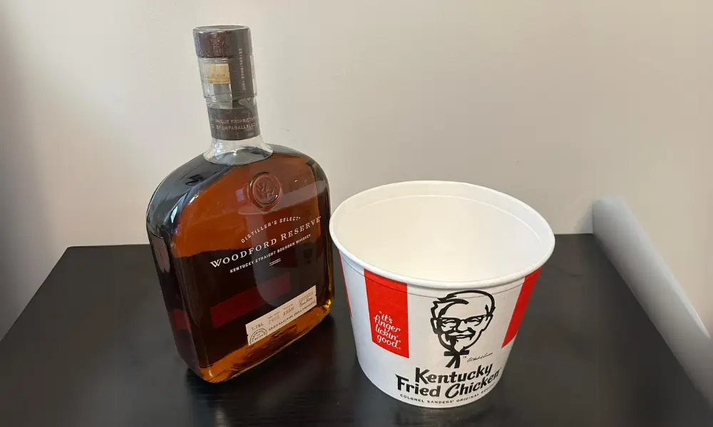 An Ole Miss fan is honoring a bet to drink an entire KFC bucket worth of Bourbon after an upset loss to the Kentucky Wildcats.