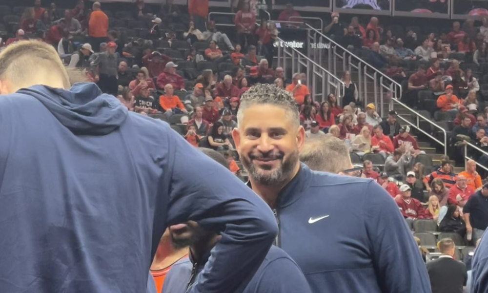 Former Kentucky assistant coach Orlando Antigua smiles as he beats his mentor John Calipari.