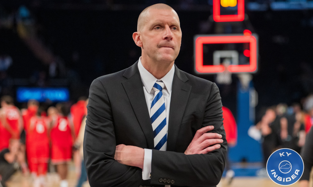 Mark Pope stands disappointed after Kentucky's loss to Ohio State.