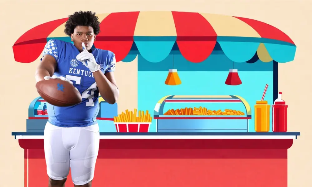 A Kentucky football player was seen at buying food from the concession stand in Kentucky's 41-14 loss to Louisville.