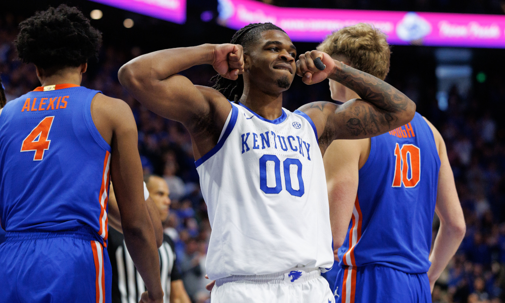 Kemtucky guard Otega Oweh flexes after hitting a shot and finishing through contact.