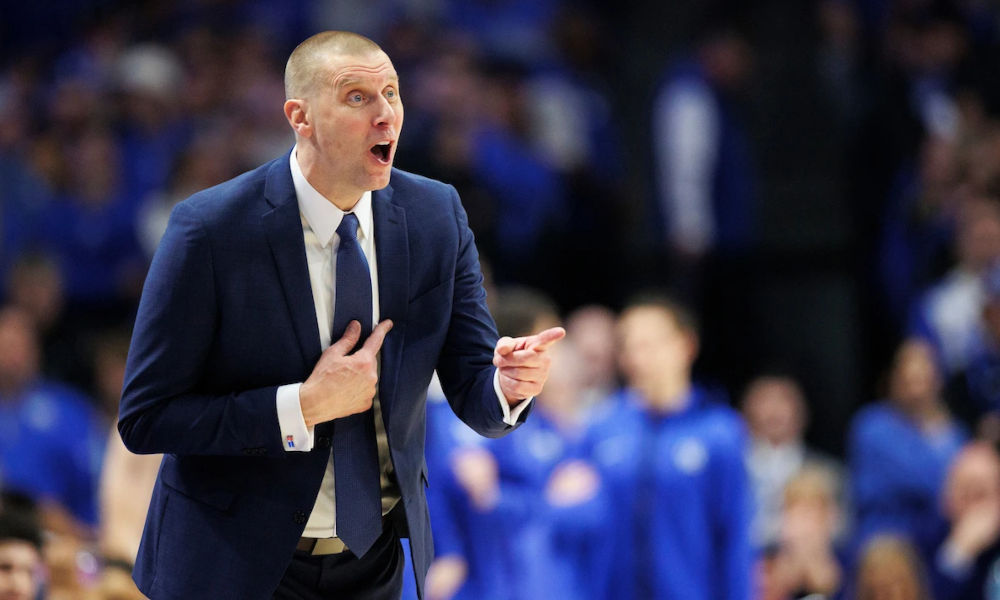 Kentucky head coach Mark Pope coaching from the sidelines at Rupp Arena.