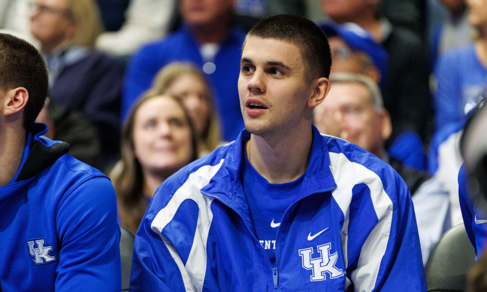 Kentucky Wildcats guard Kerr Kriisa watches the action from the bench while he sits with an injury.