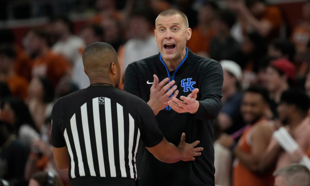 entucky Wildcats head coach Mark Pope argues with an official.