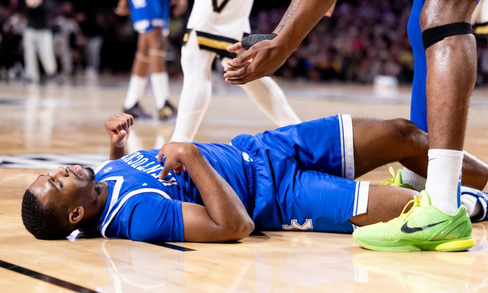 Kentucky guard Lamont Butler falls to the floor.