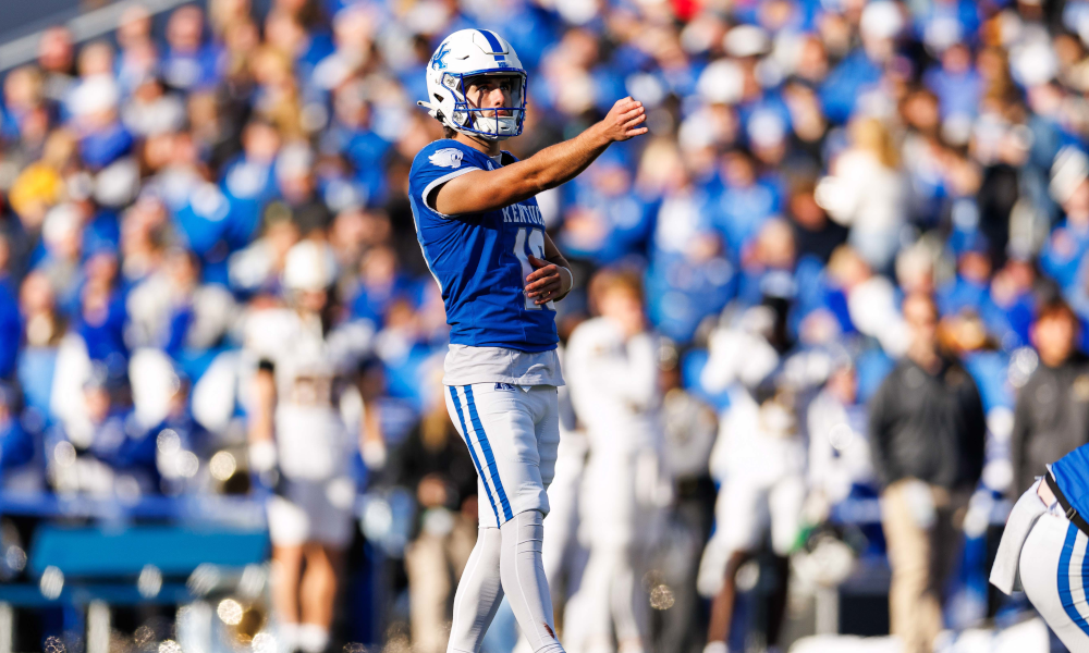 Kentucky Wildcats place kicker Alex Raynor (16) lines up a kick.