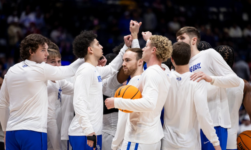 The Kentucky Wildcats huddle together before a game.