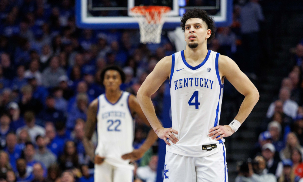 Kentucky Wildcats guard Koby Brea (4) looks on as a teammate shoots a free throw.