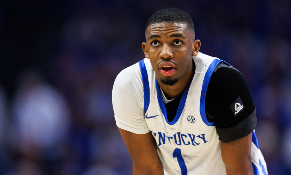 Kentucky Wildcats guard Lamont Butler (1) looks on with a shoulder brace.