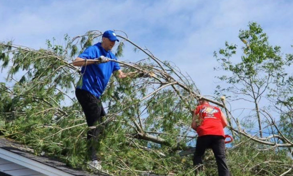 Mark Pope lends a helping hand.