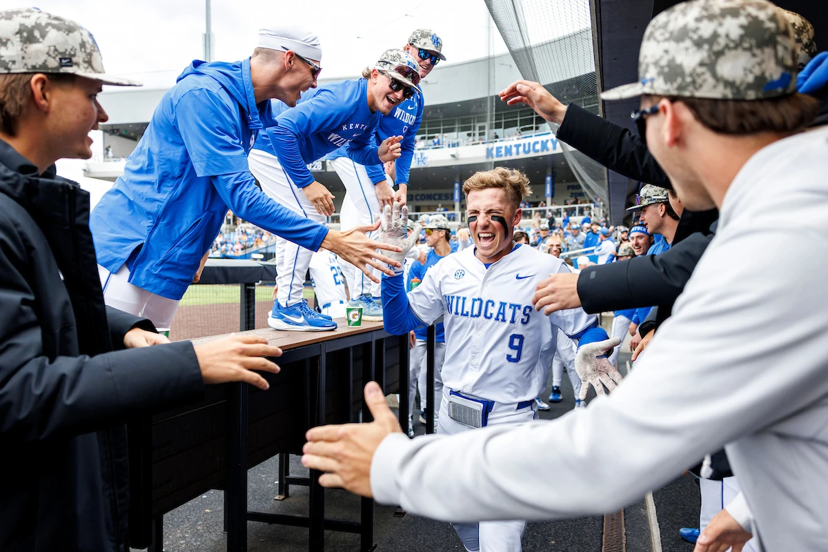 Ethan Hindle celebrates in the dugout in Game 2. Photo by Eddie Justice from UK Athletics.